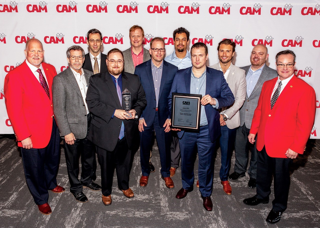 Representatives from the Shinola Hotel construction project team accept the CAM Magazine Project of the Year award. The team is flanked by CAM Chairman of the Board Samuel J. Ruegsegger III (on the far left) and CAM President Kevin Koehler (on the far right).